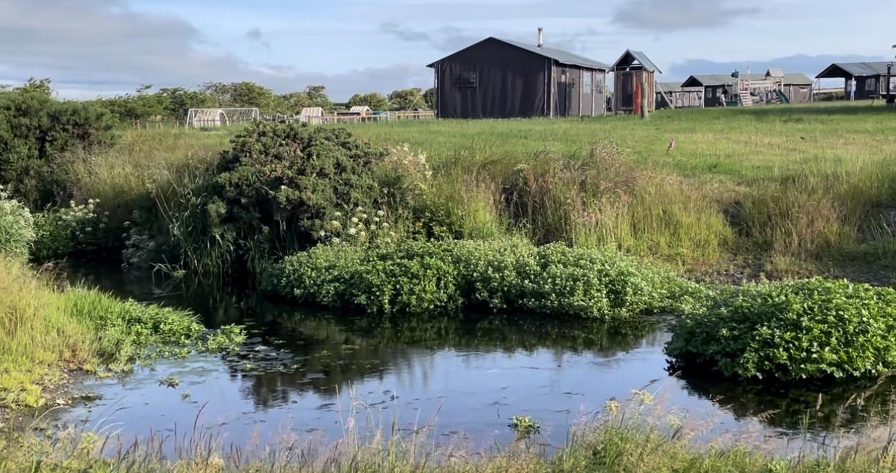 Off grid safari tents next to the water at Balnab Dairy Farm