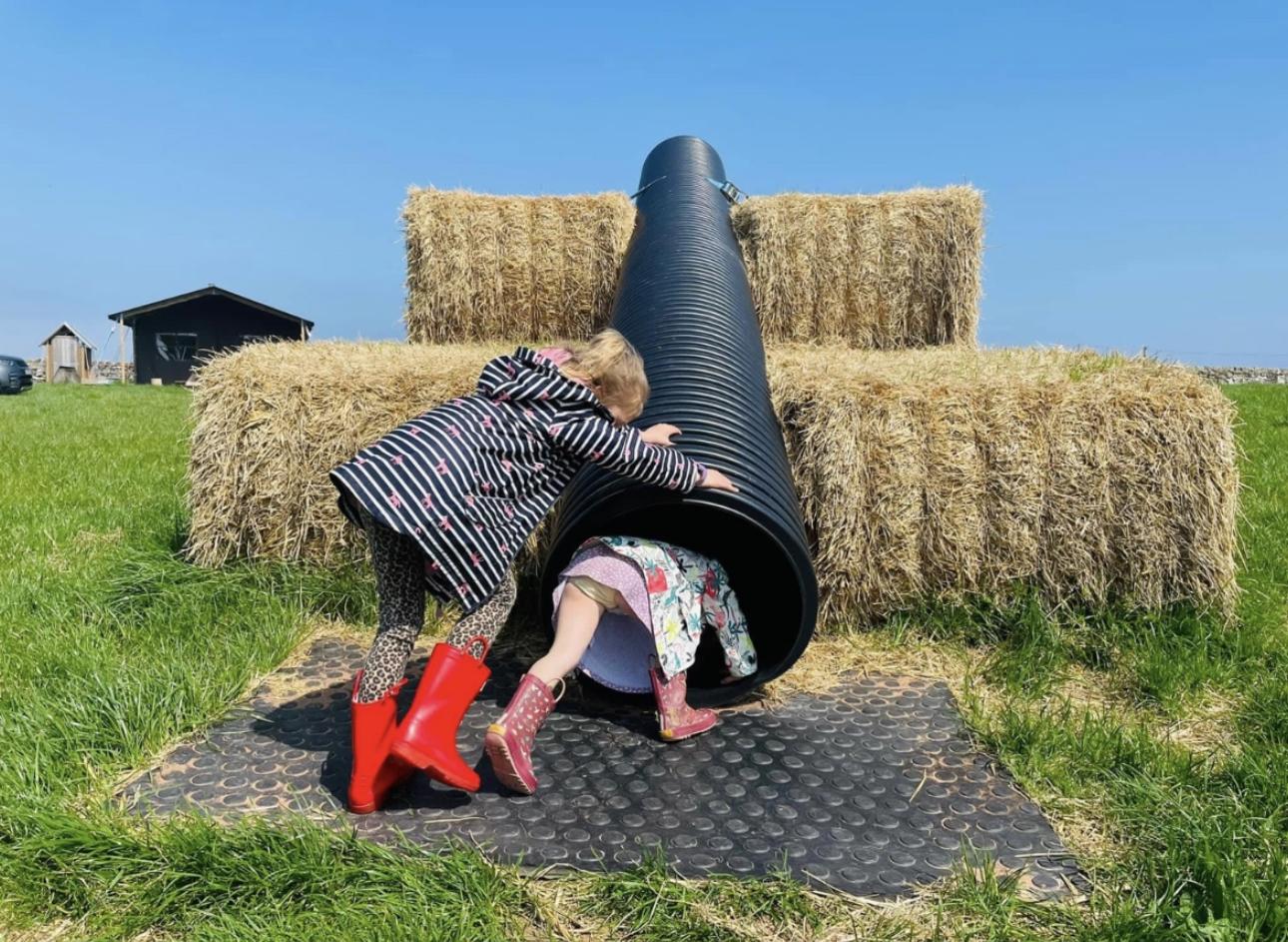 Playing on slide at Balnab Dairy Farm